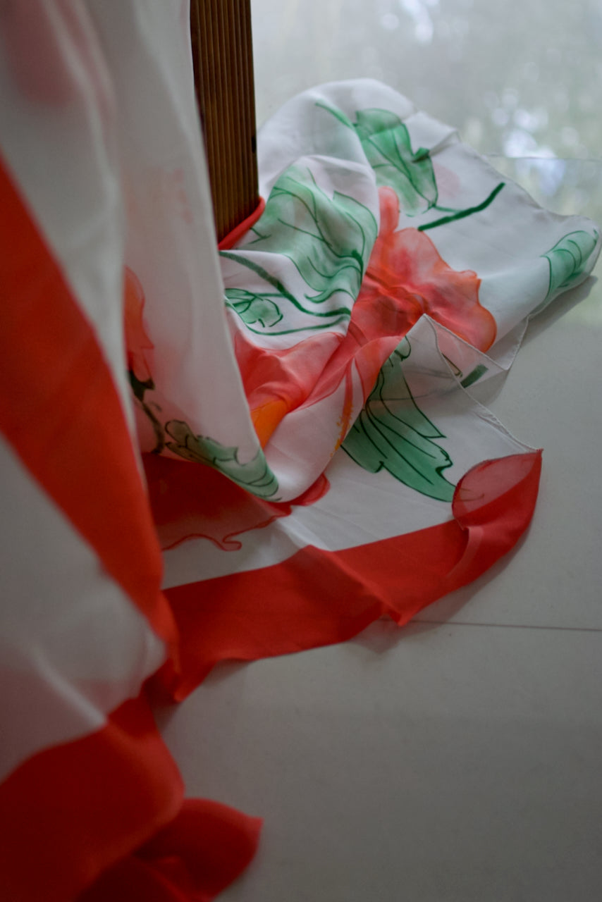 Snow white organza saree with red hand painted and printed floral art