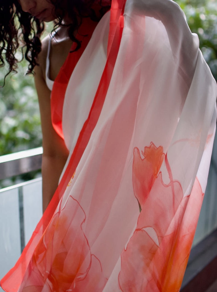 Snow white organza saree with red hand painted and printed floral art