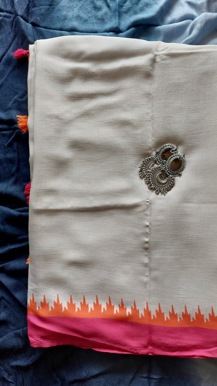 Muslin handcrafted, naturally dyed running saree blouse piece in a shade of white with popping colour combination of orange and pink.