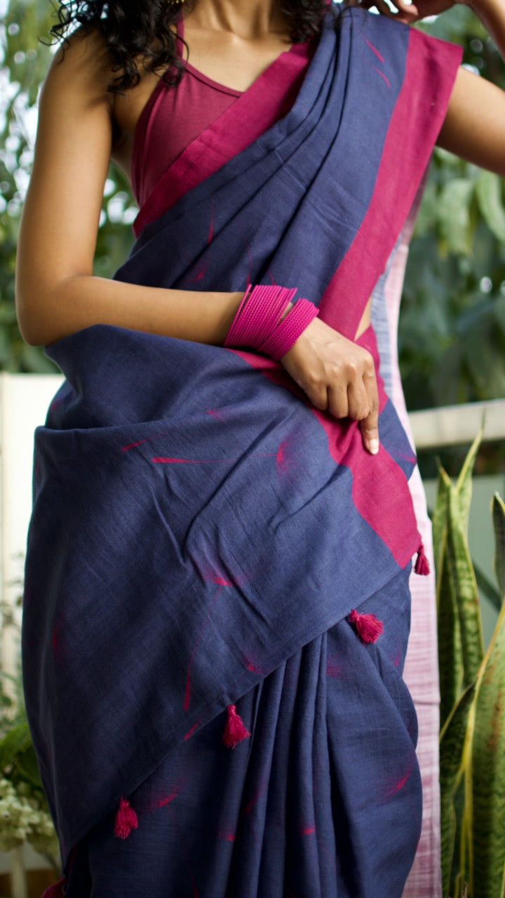 Linen Cotton handcrafted, naturally dyed saree in blue colour with deep pink border and dandelion motifs.