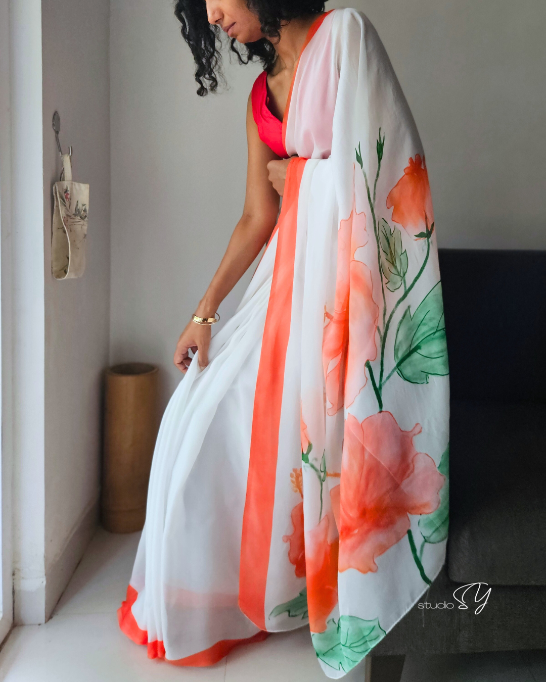 Snow white organza saree with red hand painted and printed floral art