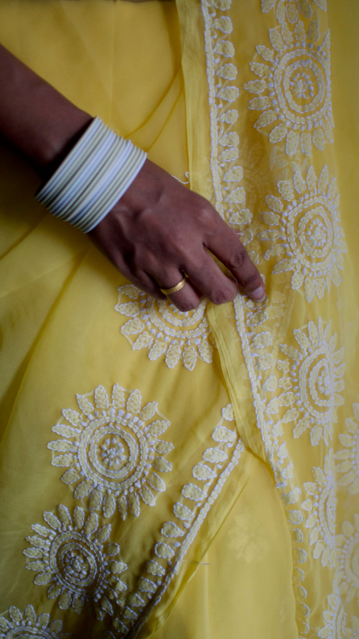 Vibrant yellow hand embroidered chikankari saree by studio SY