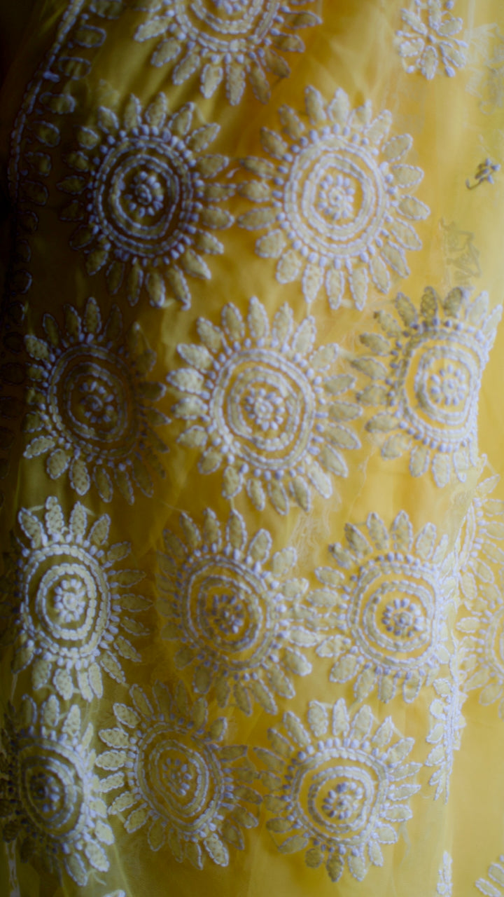 Vibrant yellow hand embroidered chikankari saree by studio SY