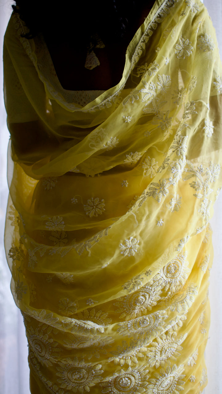 Vibrant yellow hand embroidered chikankari saree by studio SY