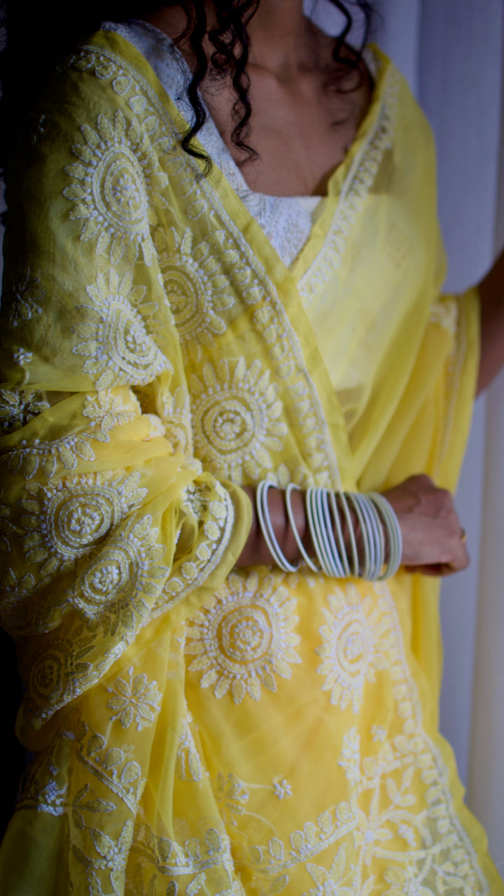 Vibrant yellow hand embroidered chikankari saree by studio SY