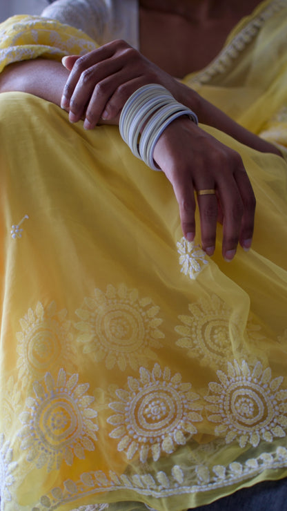 Vibrant yellow hand embroidered chikankari saree by studio SY