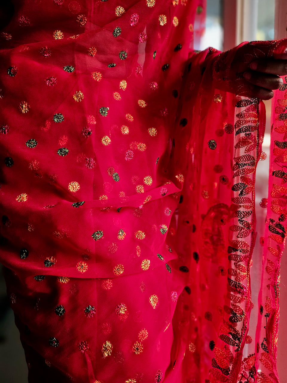 Tomato red saree with multihued silk thread hand embroidered chikankari saree by studio SY