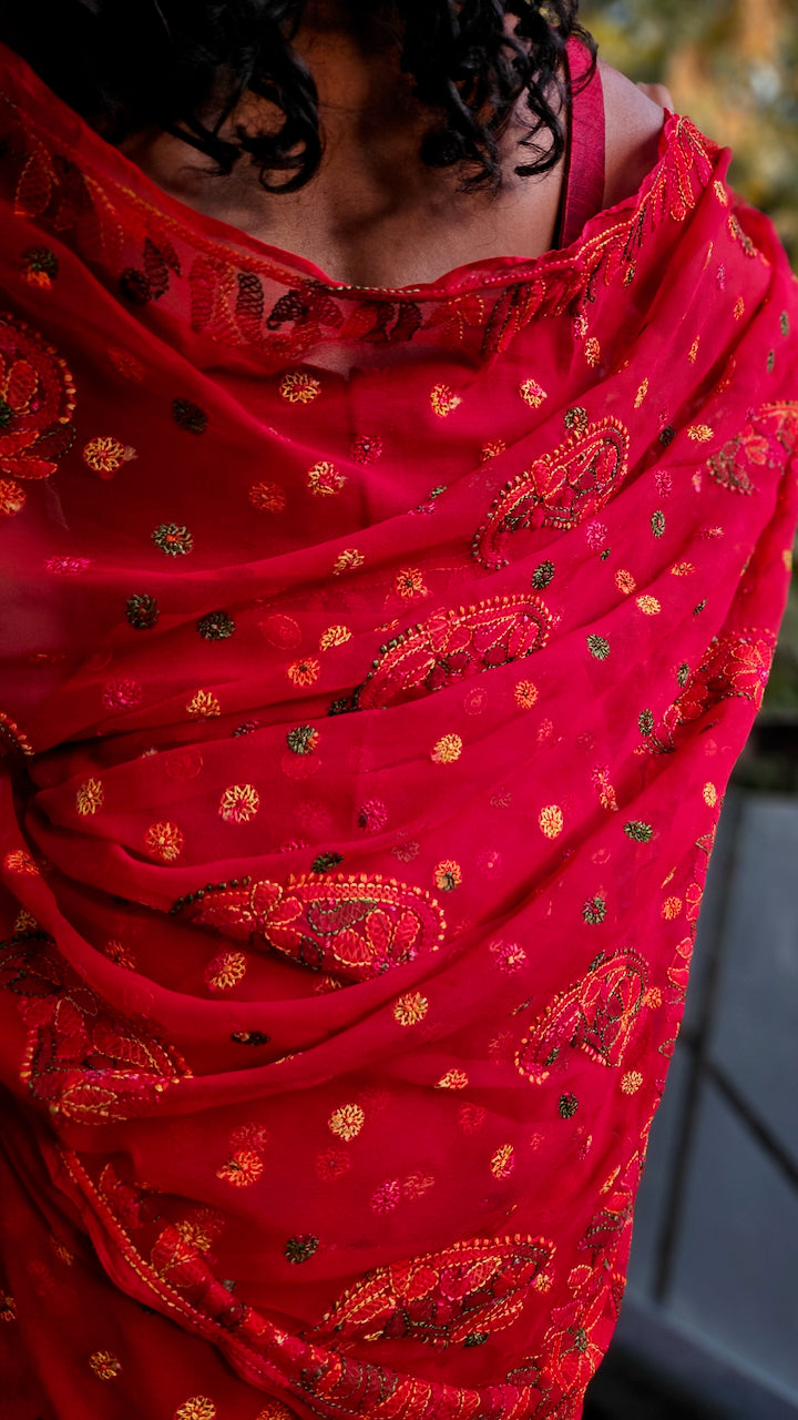 Tomato red saree with multihued silk thread hand embroidered chikankari saree by studio SY