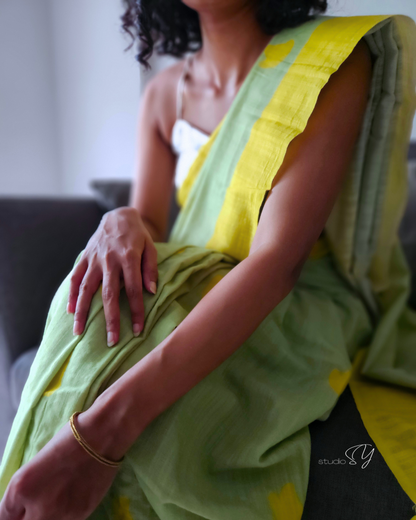 Linen handcrafted handloom saree, dyed with green natural dye and all over yellow butterfly motif print