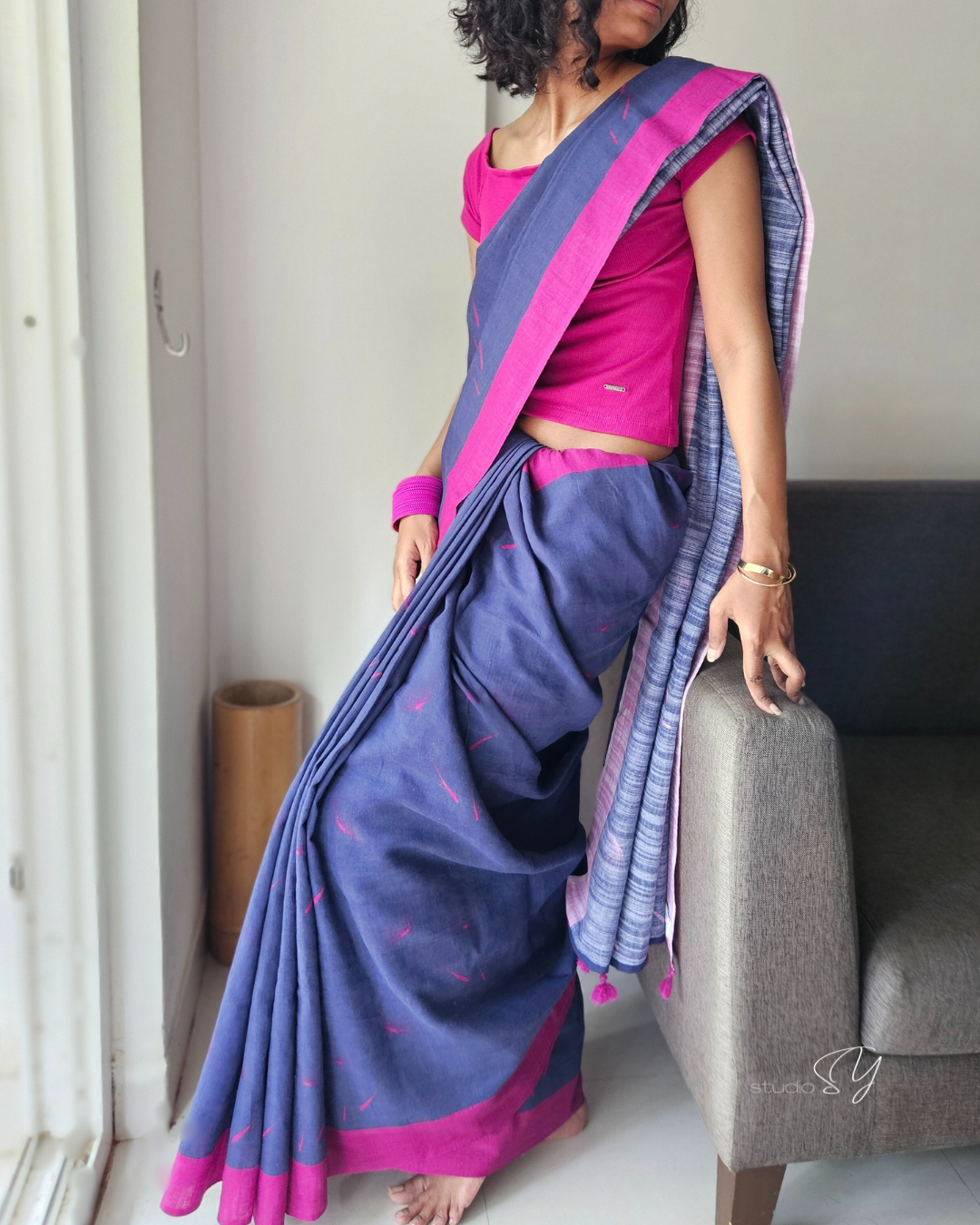 Linen Cotton handcrafted, naturally dyed saree in blue colour with deep pink border and dandelion motifs.