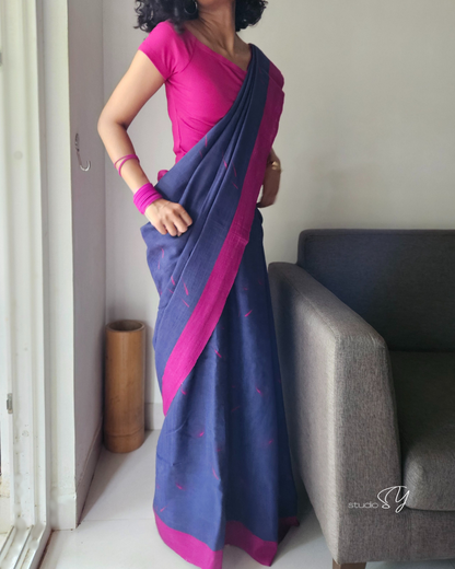 Linen Cotton handcrafted, naturally dyed saree in blue colour with deep pink border and dandelion motifs.