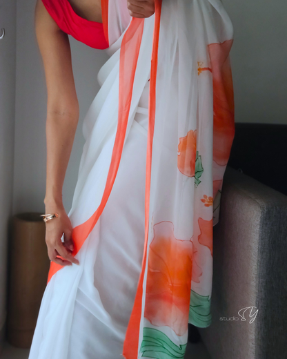 Snow white organza saree with red hand painted and printed floral art