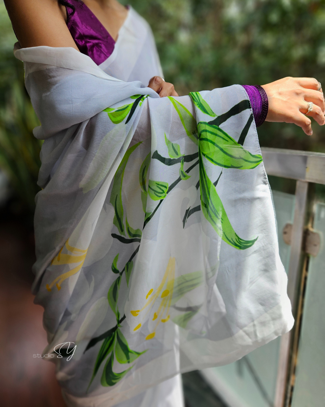 Dove grey organza saree with white hand painted and printed floral art