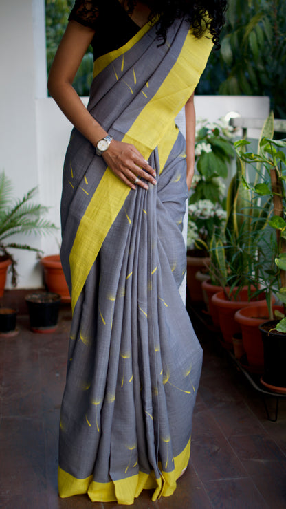 Linen Cotton handcrafted, naturally dyed saree in grey colour with yellow border and dandelion motifs.