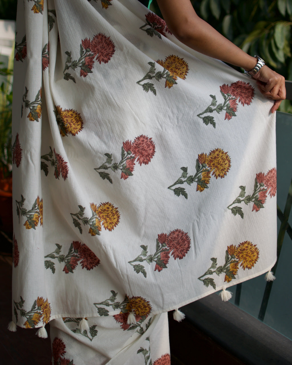 Cotton handcrafted, naturally dyed saree in white colour with handblocked floral motifs and all over kantha weave in white thread.