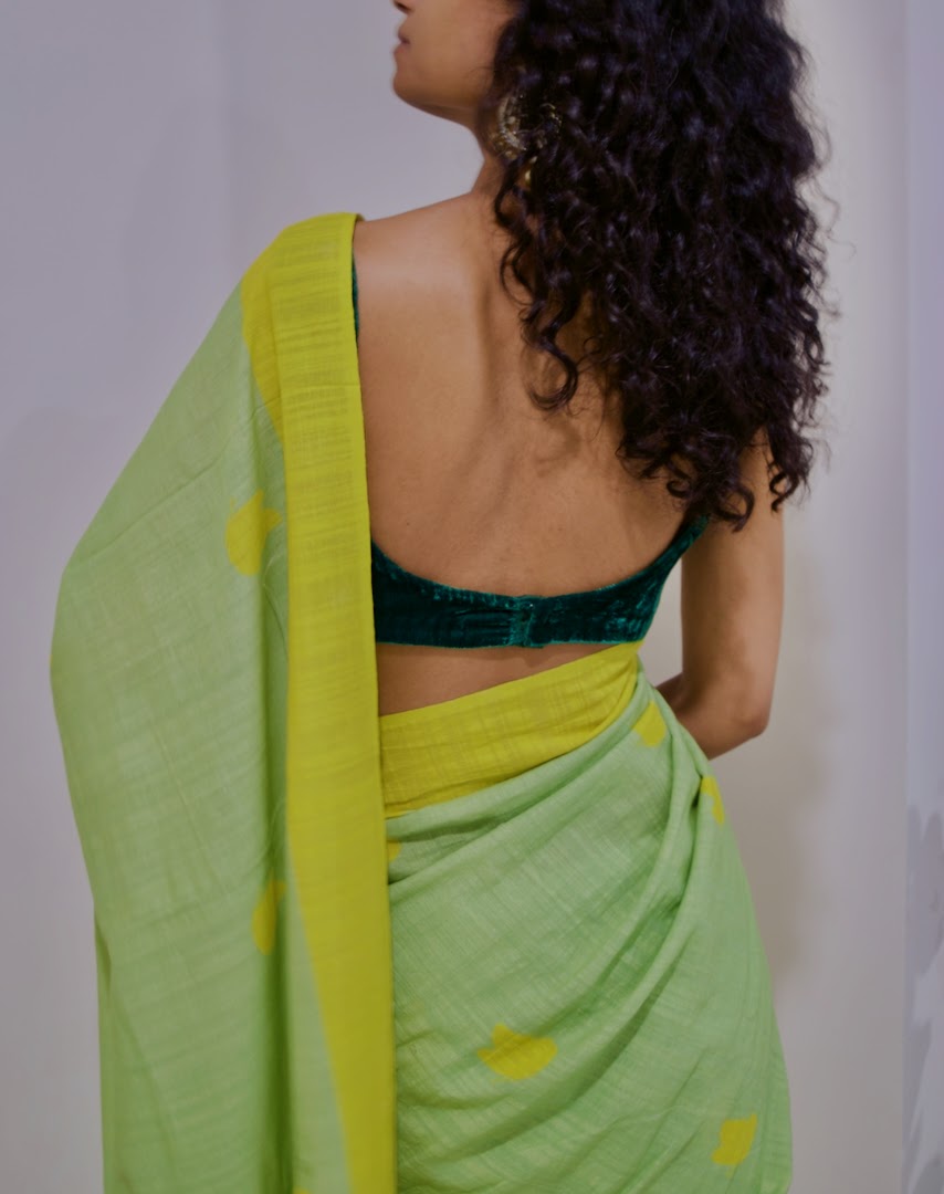 Linen handcrafted handloom saree, dyed with green natural dye and all over yellow butterfly motif print