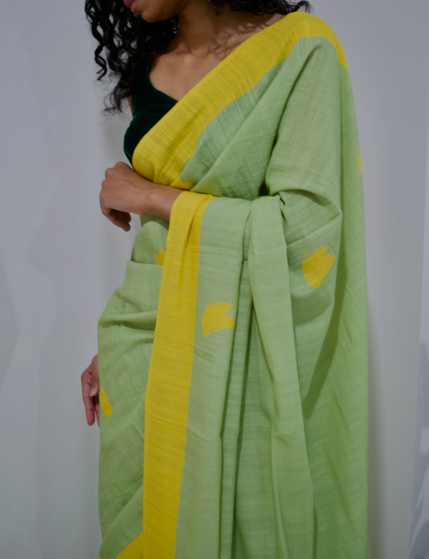 Linen handcrafted handloom saree, dyed with green natural dye and all over yellow butterfly motif print