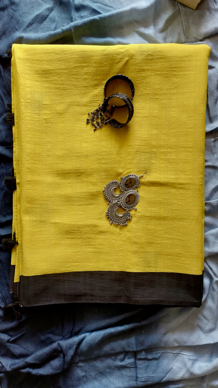 Linen Cotton handcrafted, naturally dyed running saree blouse in yellow colour with black border.
