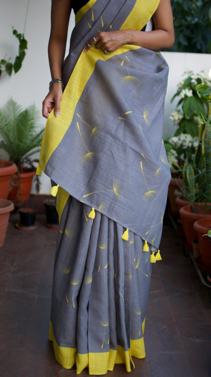 Linen Cotton handcrafted, naturally dyed saree in grey colour with yellow border and dandelion motifs.